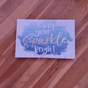 Blue sign, gold lettering, positive quote